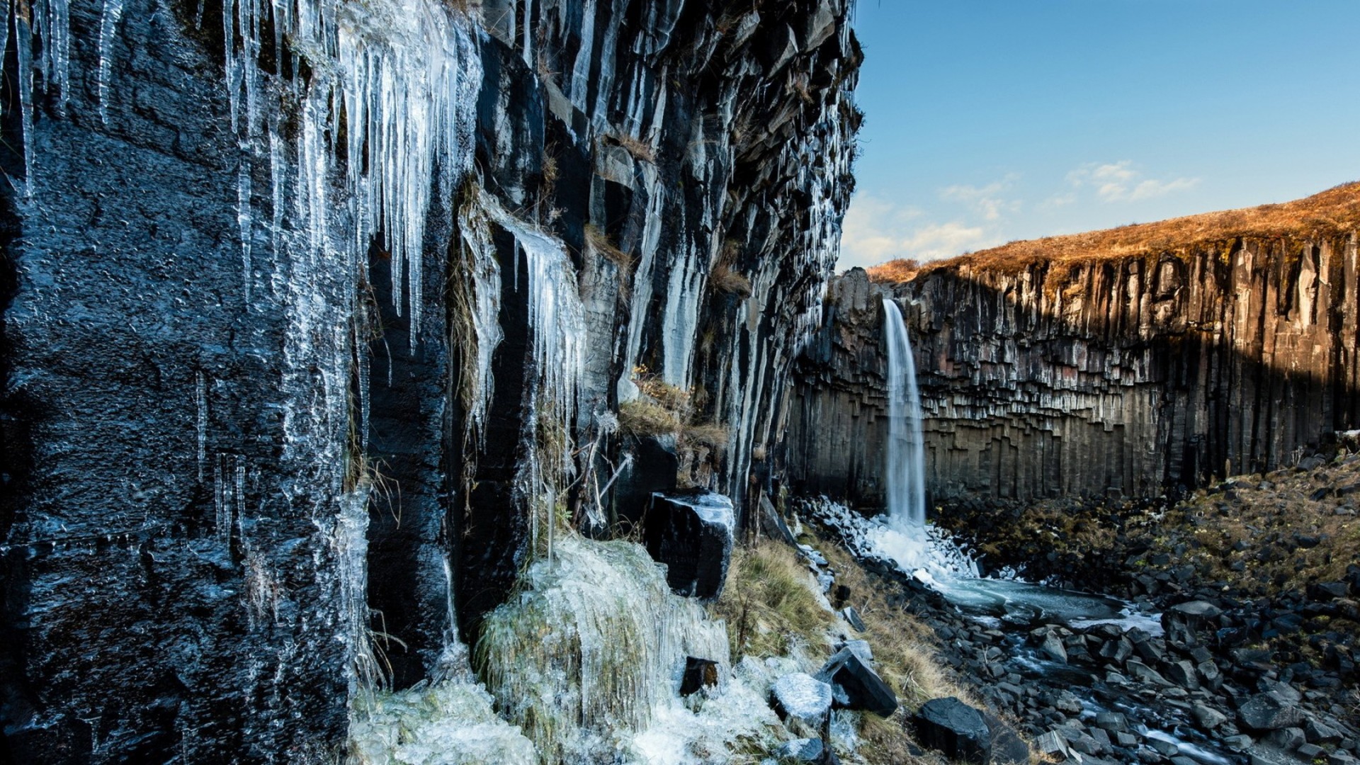 Waterfall Icicles On Formation Cliff HD Desktop Background